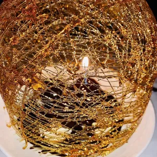 a cake covered in gold paint