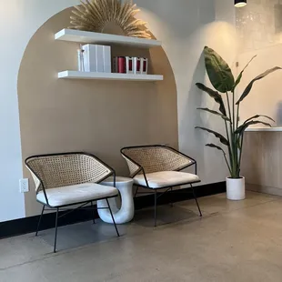 There's a cute little lounge are as you enter on both sides. This one is on the left side. They also feature their merch on the wall