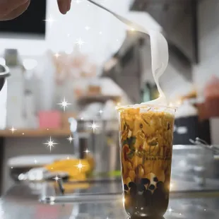  person stirring up a drink
