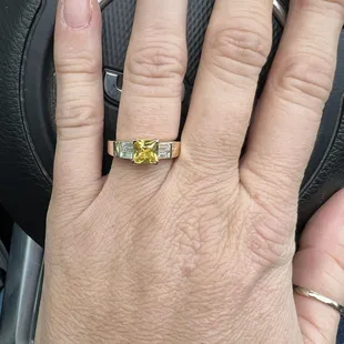 Yellow sapphire with diamond baguettes