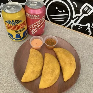 three empanadas on a plate