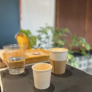 Flat white and espresso with a side of sparkling water