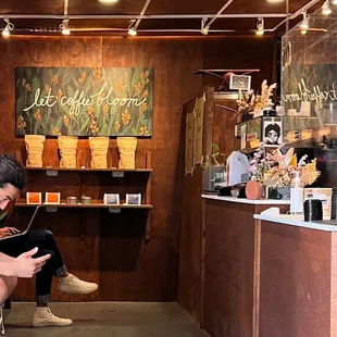 a man sitting on a bench looking at his phone