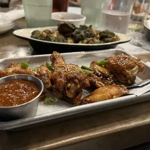Szechuan wings with a side of fire sauce Crispy Brussel Sprouts