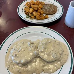 Sausage and home fries with biscuits and gravy