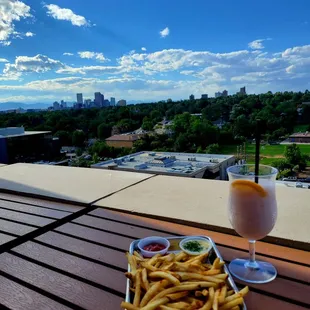 Enjoying the views with a frozen cocktail and fries