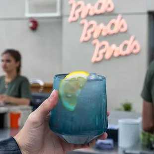 New Rare Bird sign and cocktail.