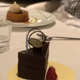 Double chocolate cake, other dessert in background