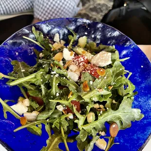 a blue bowl of salad