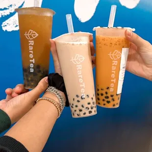 Left to Right: mango passion fruit tea with boba, classic black milk tea with boba, Thai tea with boba