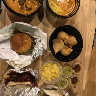 Chicken, Lamb in Tika sauce Rice Bowls. Samosas. Burger. Paneer Tacos with Sauces. An extra side of Cravable Saffron Rice. Licking now