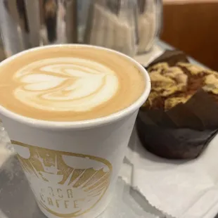 a cup of coffee and a pastry