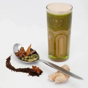 a glass of green tea and spices