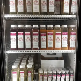 a refrigerator full of juices