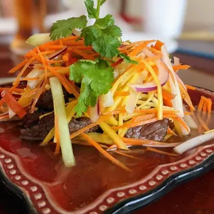 Beef Mango Salad. Fresh mango salad and sliced beef with citrus dressing. $9.95.