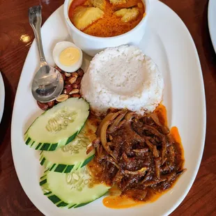 Rasa Malaysia Nasi Lemak. Authentic sambal ikan bilis, crispy ikan bilis, curry chicken, egg, cucumber, roasted peanut, coconut rice. $15.95