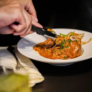 Lamb Osso Buco Nihari: Potato salli, pickled shallots