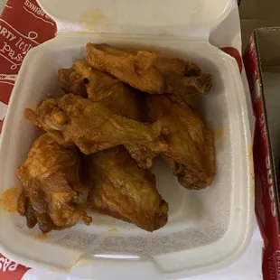 Hot wings. Not swimming in sauce. Ask for extra sauce if you're like me and love it juicy.
