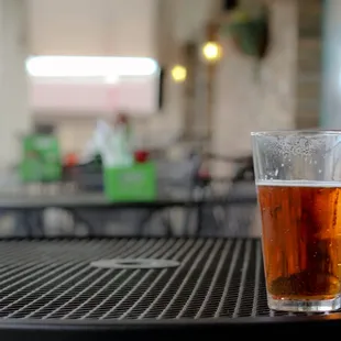 a glass of beer on a table