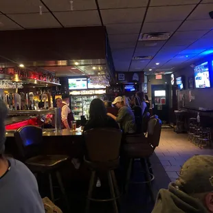 people sitting at the bar