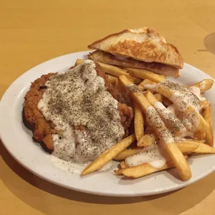 Chicken fried steak , and yes I put all that pepper on it. I like black pepper.