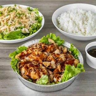 a bowl of rice and a bowl of chicken