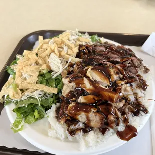 Teriyaki combo Teri Deluxe (half chicken half beef) with a Chinese Chicken Salad. $12.75 as of March 2023 and totally delicious.