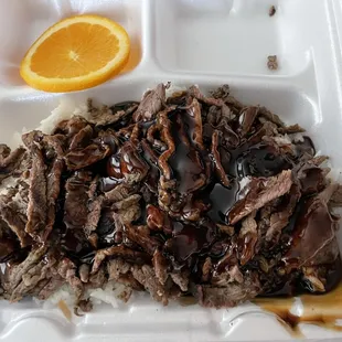 beef and rice in a styrofoam container