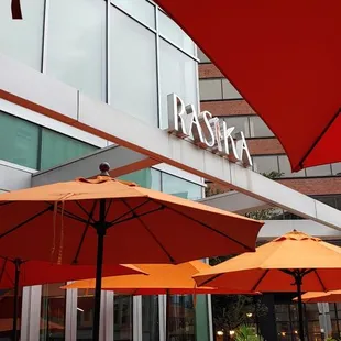 Large patio seating with movable umbrellas.