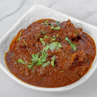 a close up of a bowl of curry