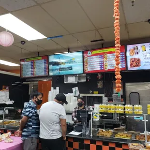 a man ordering food at a restaurant