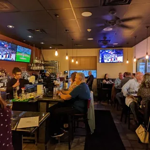 people sitting at the bar