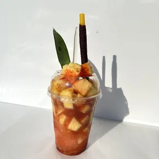Empinada Loca (shaved ice topped w real pineapple pieces and pineapple syrup, lime, chamoy and tajin)