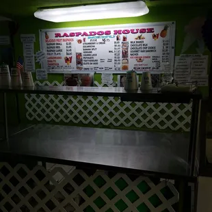 a counter with a menu on it