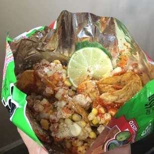 a person holding a bag of food