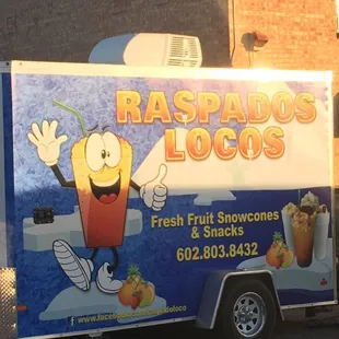 a food truck parked in front of a building