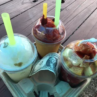 Top left Lime Raspados, top right is a mango chamoyadas and then bottom right Ensalada de Frutas con Chile