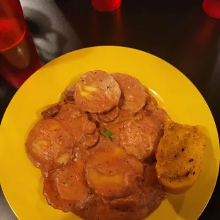 Dreadlocks ravioli with rose sauce and spicy sausage