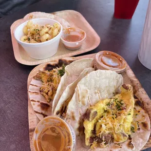 two tacos and a side of macaroni and cheese
