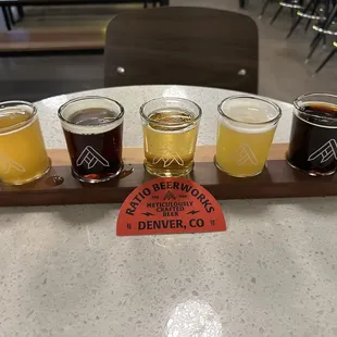 a flight of beers on a table