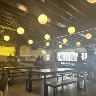 people sitting at tables and eating