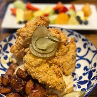 Chicken and biscuits.  Side of fresh fruit.