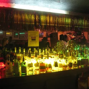a bar with bottles of alcohol