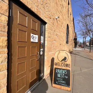 a welcome sign outside of a building