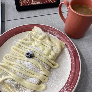 Blueberry lemon almond crepe and drip coffee with cream