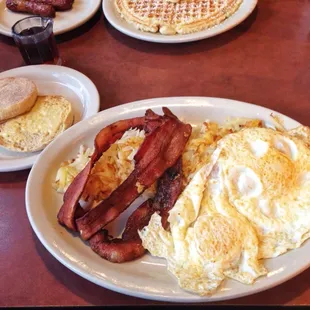 2 Egg Breakfast. Easy over eggs, bacon, hash browns, and english muffin.