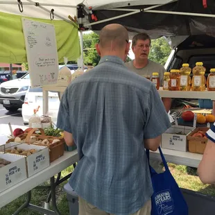eople shopping at a farmers market