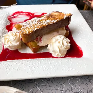 Ricotta cheese French Toast Ricotta cheese, raspberry, almond extract with whipped cream and raspberry sauce.