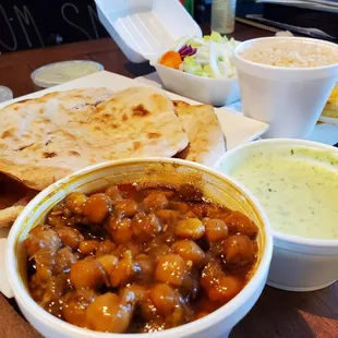Chickpeas, rice, salad, and naan