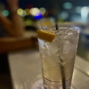a glass of lemonade on a table